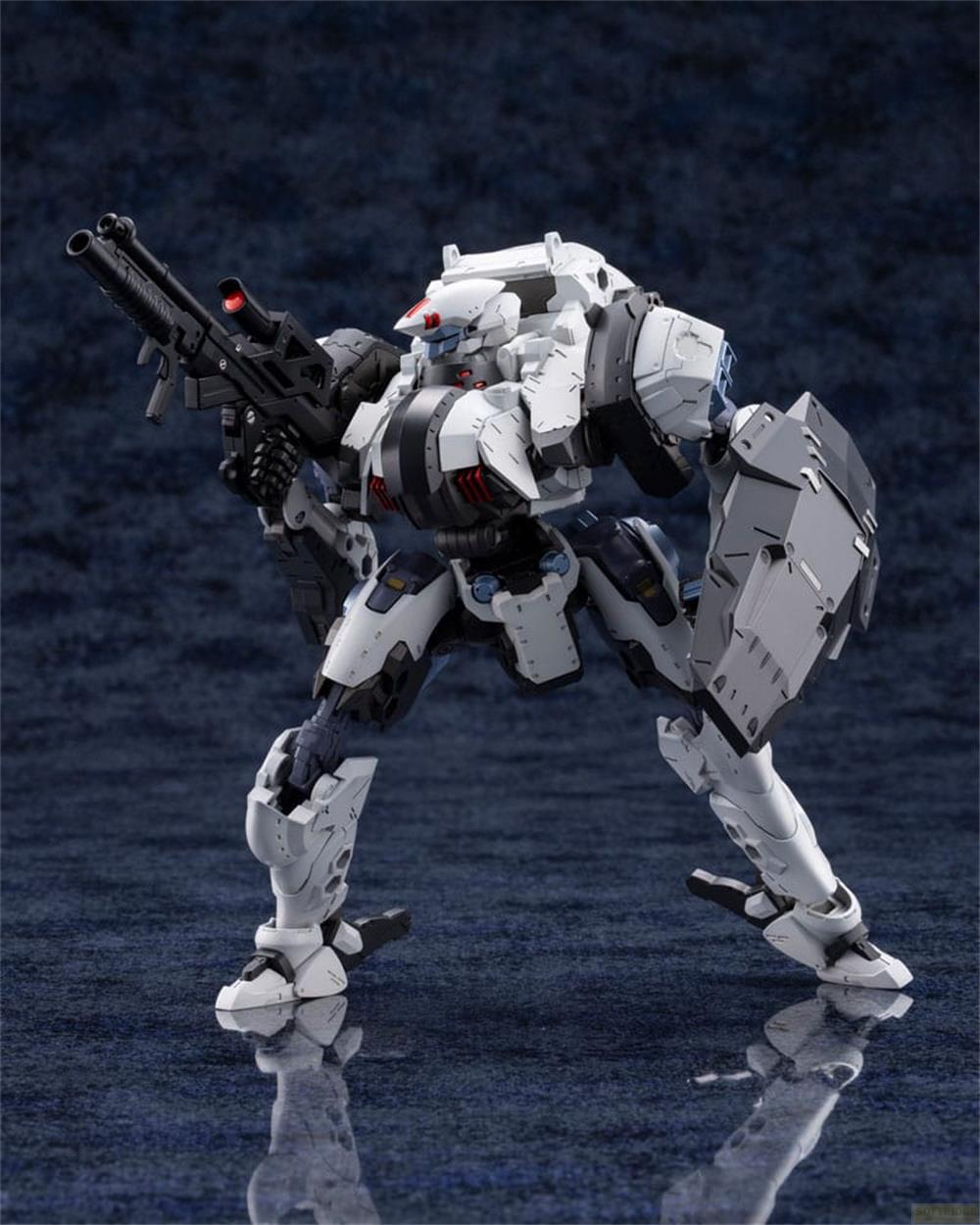 Un mech bianco con pistola e scudo neri sta su una superficie riflettente.