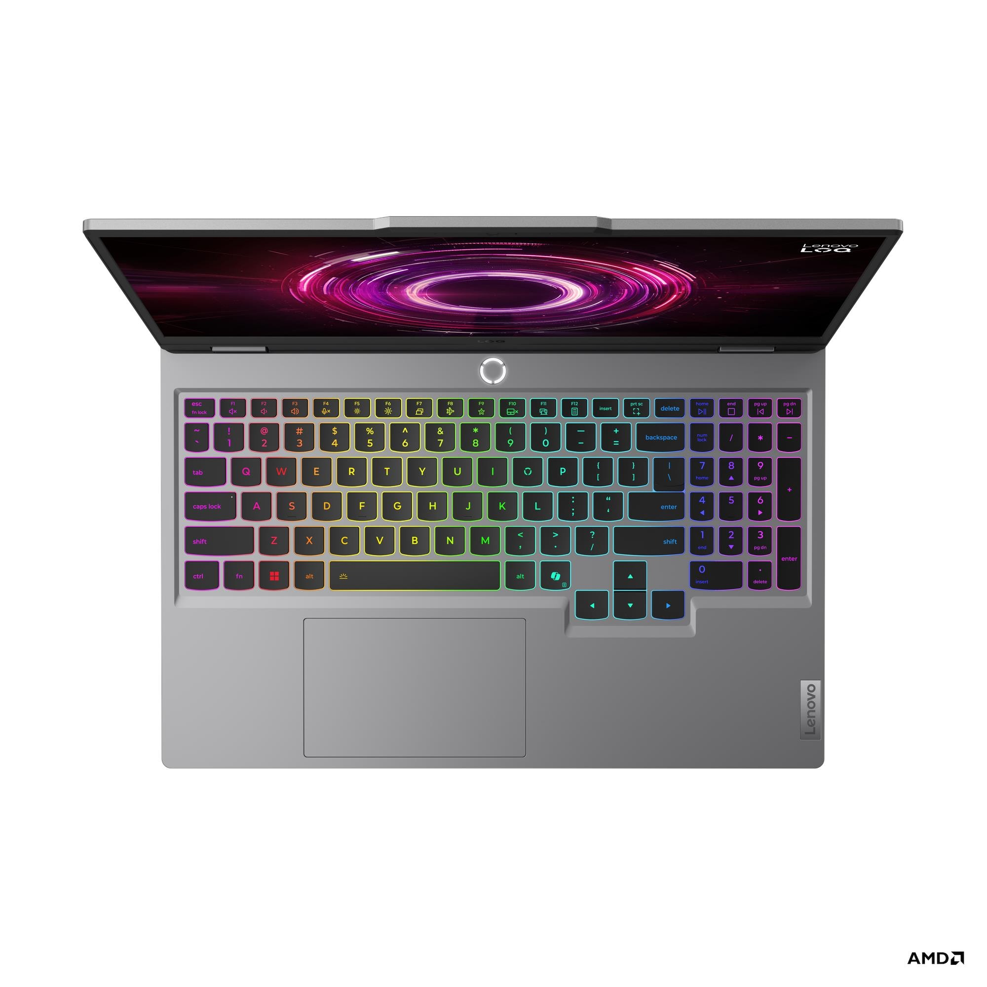 Un laptop gaming Lenovo grigio aperto con tastiera retroilluminata e sfondo rosa.