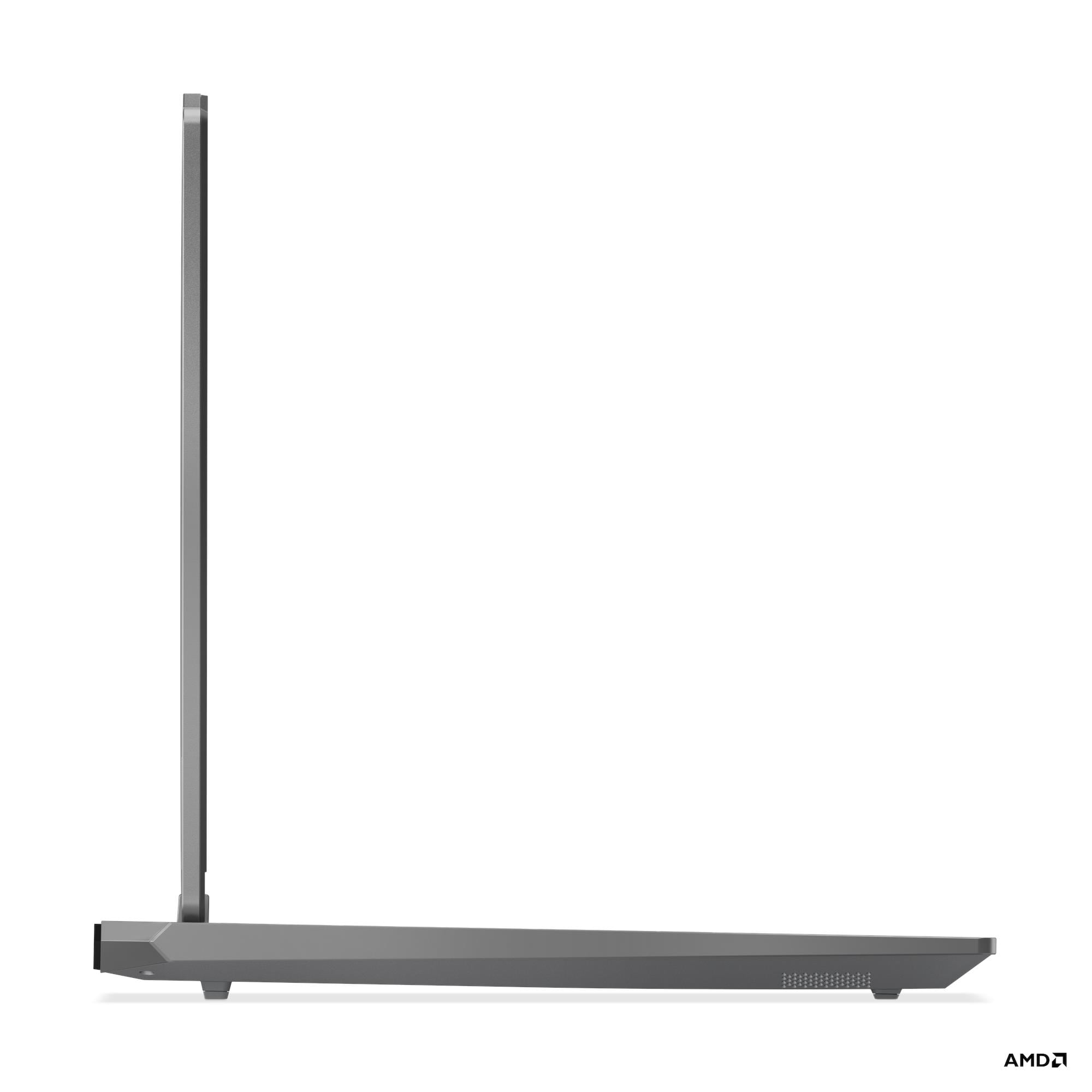 Laptop grigio in vista laterale, aperto, su sfondo bianco.
