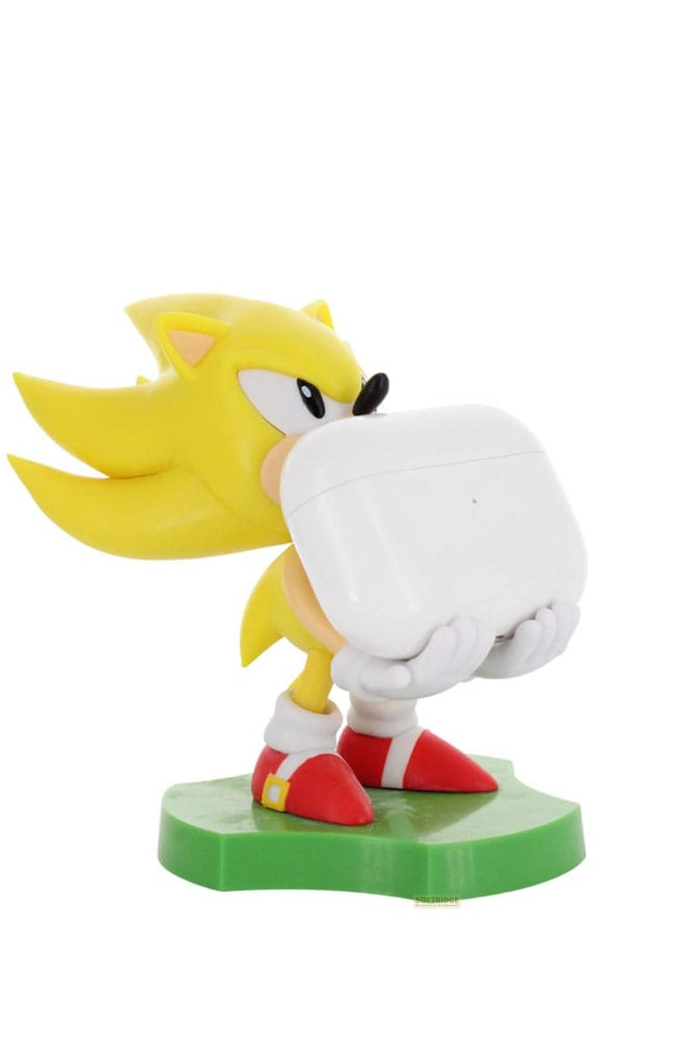 Sonic giallo con custodia bianca per auricolari su base verde.