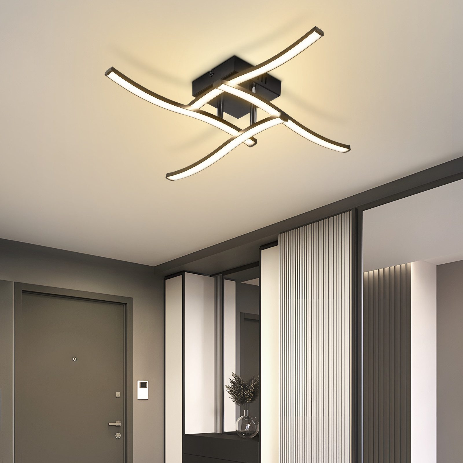 Lampada da soffitto nera moderna con bracci LED curvi in corridoio.