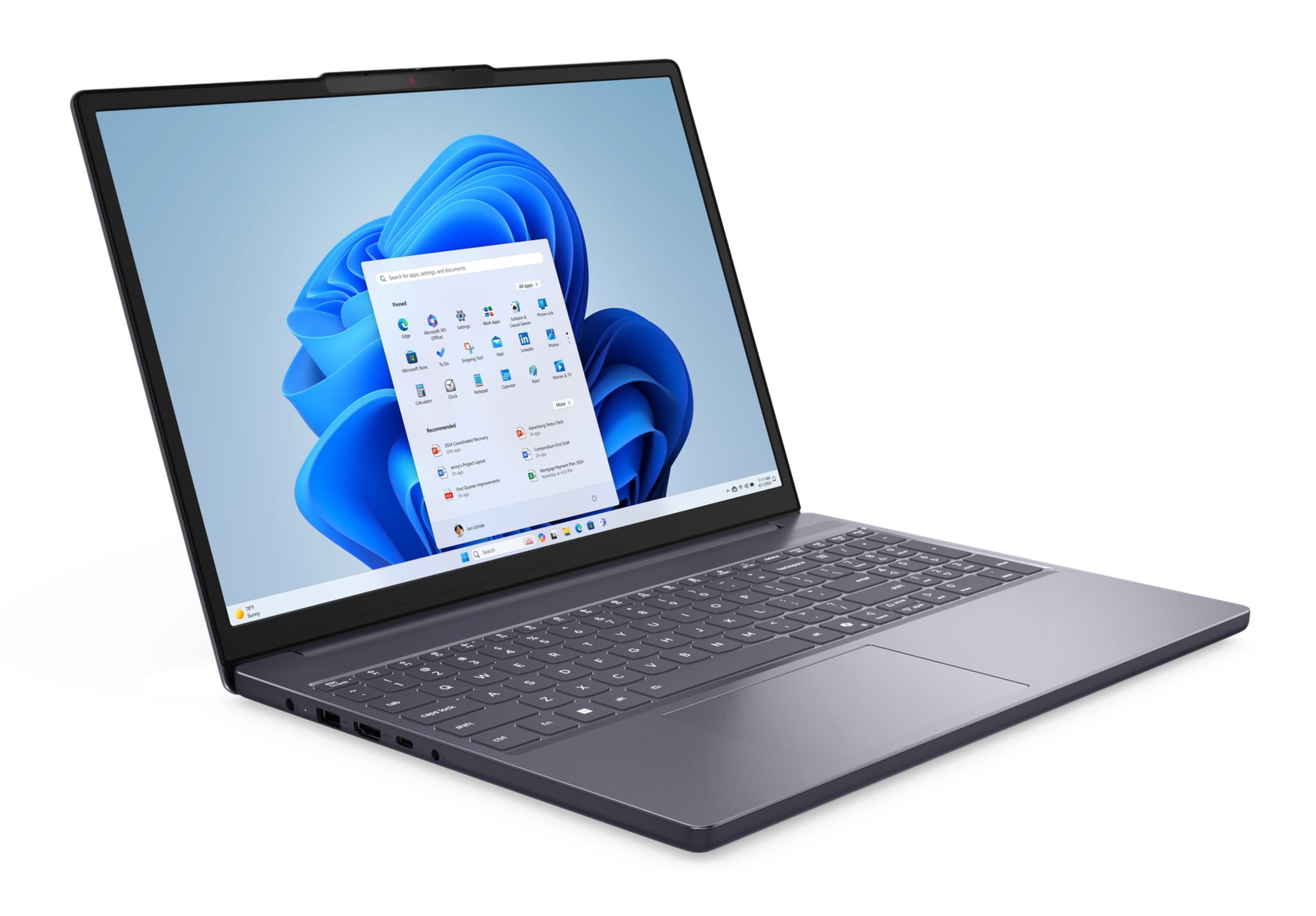 Ciemny laptop wyświetlający system Windows 11 na białym tle.