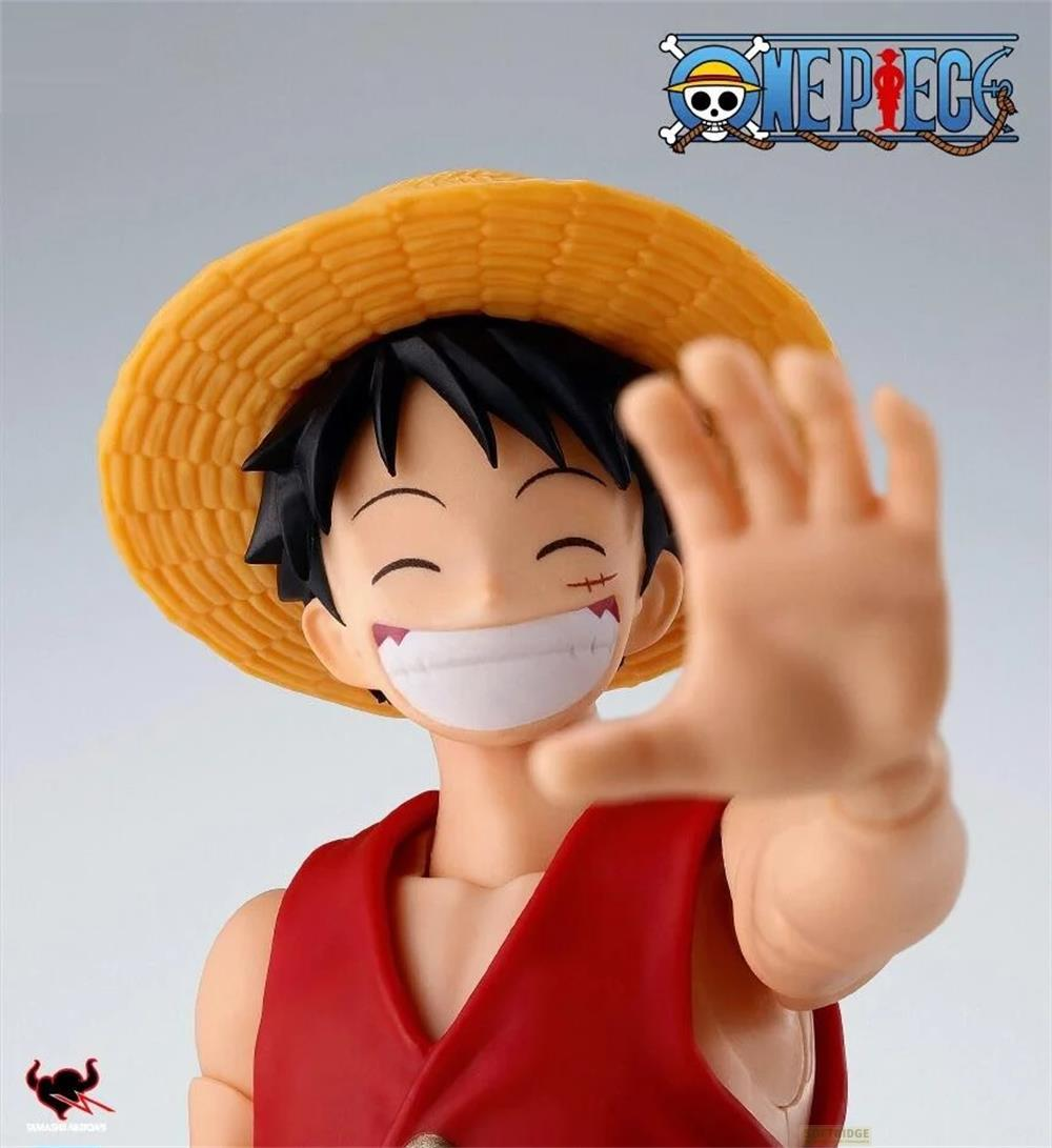 Figura de Monkey D. Luffy con sombrero de paja y chaleco rojo saluda.