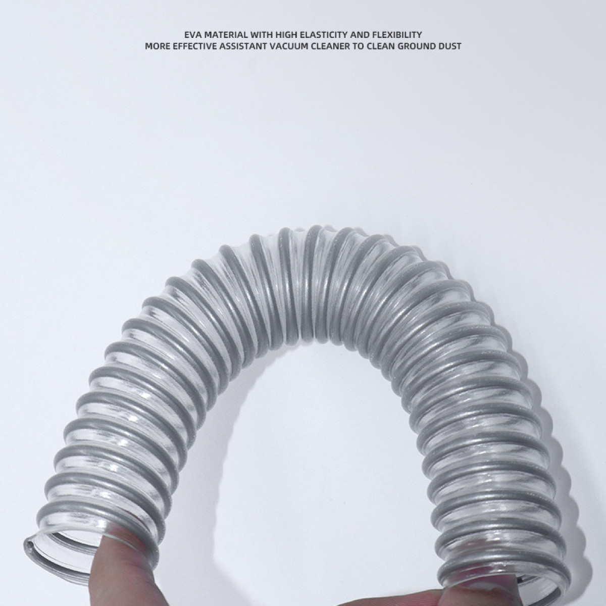 A flexible, transparent hose is held by a hand.