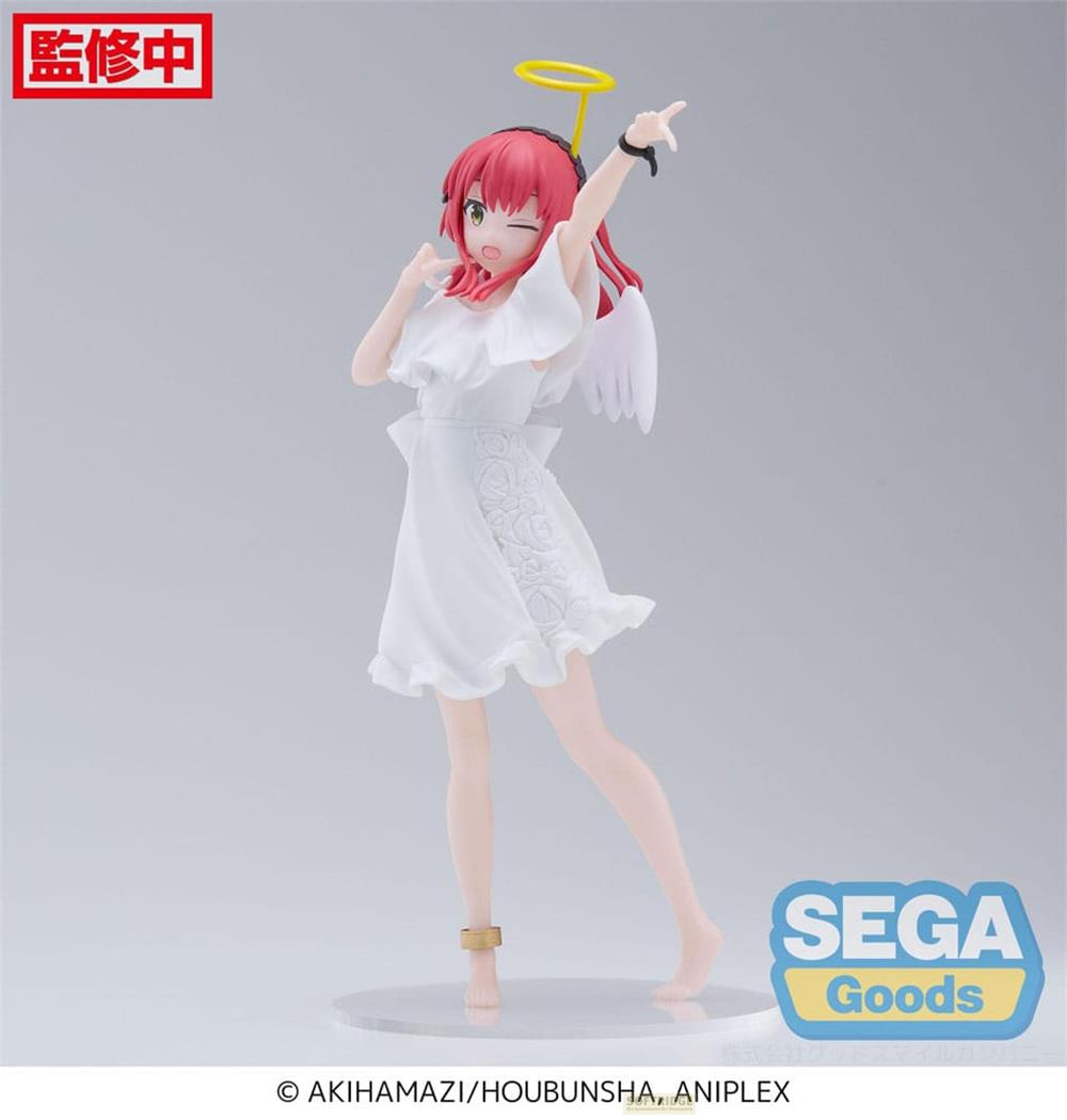Figur eines Engels mit roten Haaren, weißem Kleid, Heiligenschein und Flügeln.