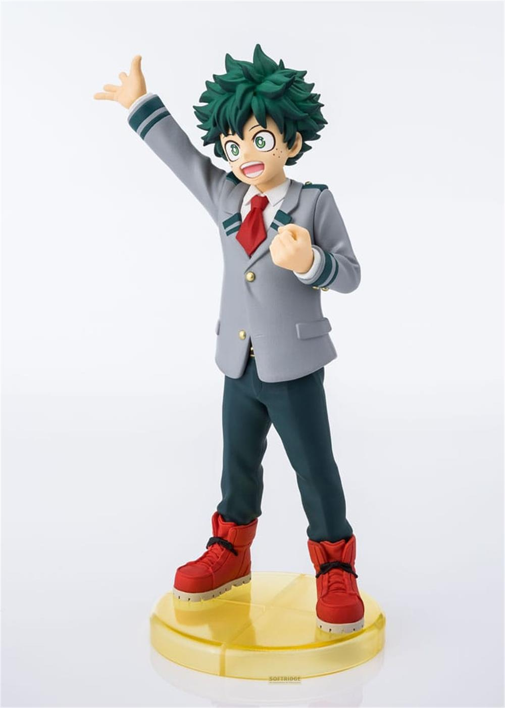 Una figura con pelo verde, chaqueta gris, corbata roja y botas rojas.