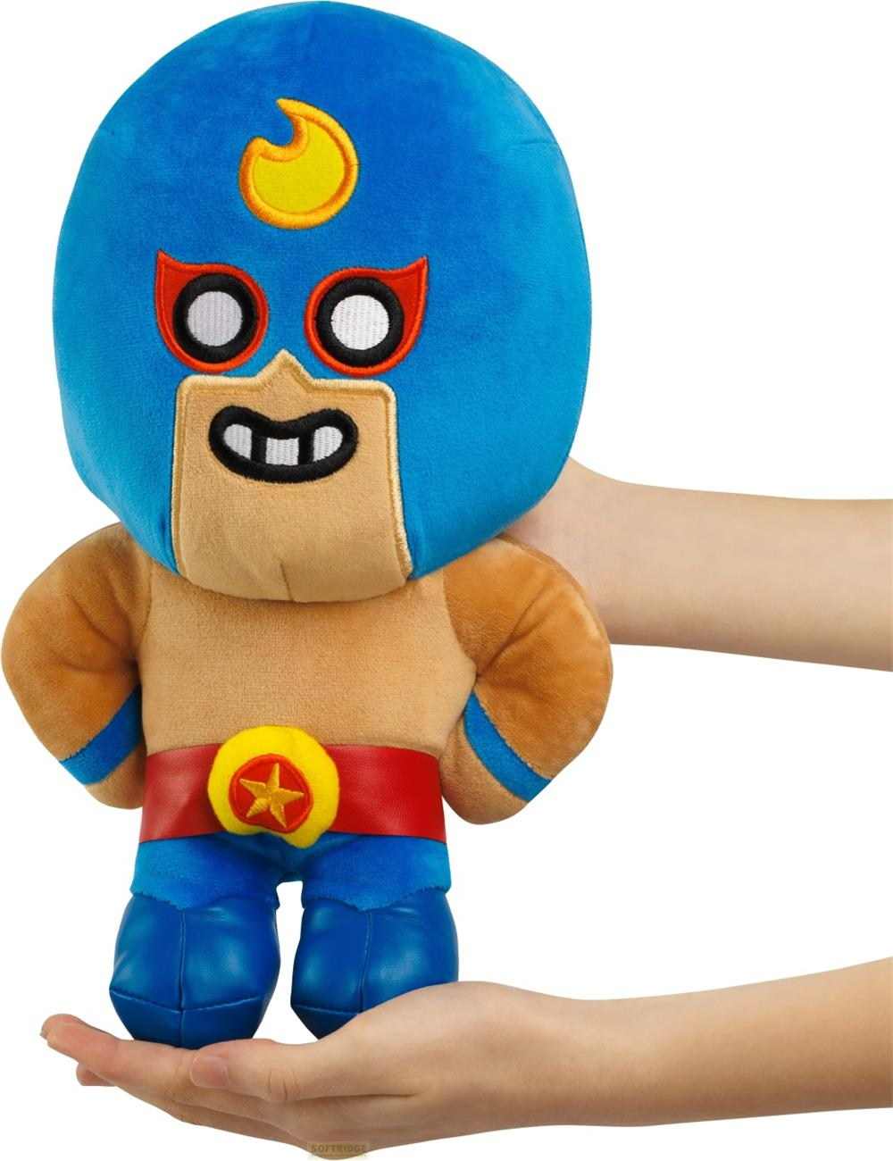 Un personaggio di peluche blu con copricapo a fiamma gialla e cintura rossa.