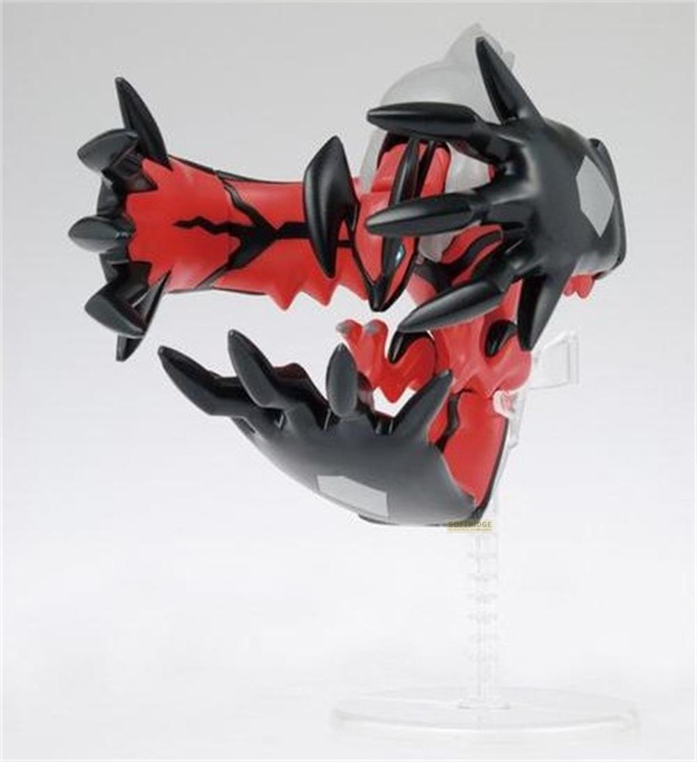 Une créature rouge et noire avec des griffes acérées sur un support transparent.