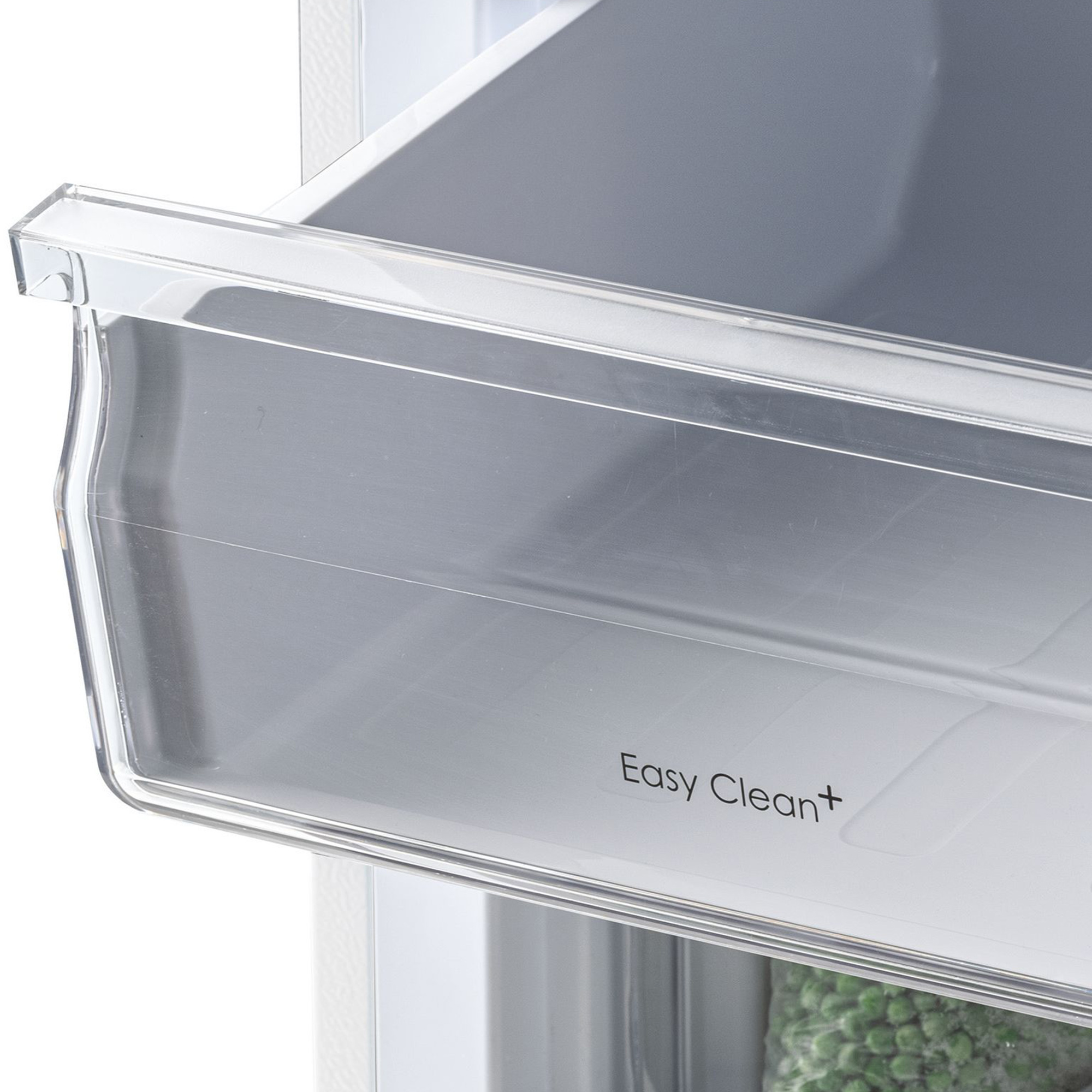 Eine transparente Schublade mit der Aufschrift „Easy Clean+“ und gefrorene Erbsen.