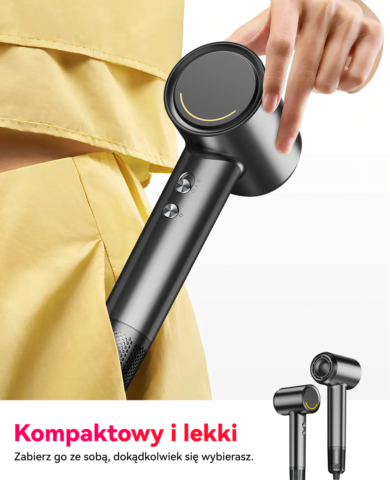 Dłoń trzyma czarną suszarkę do włosów na tle żółtej tkaniny. Dwie inne z tyłu.