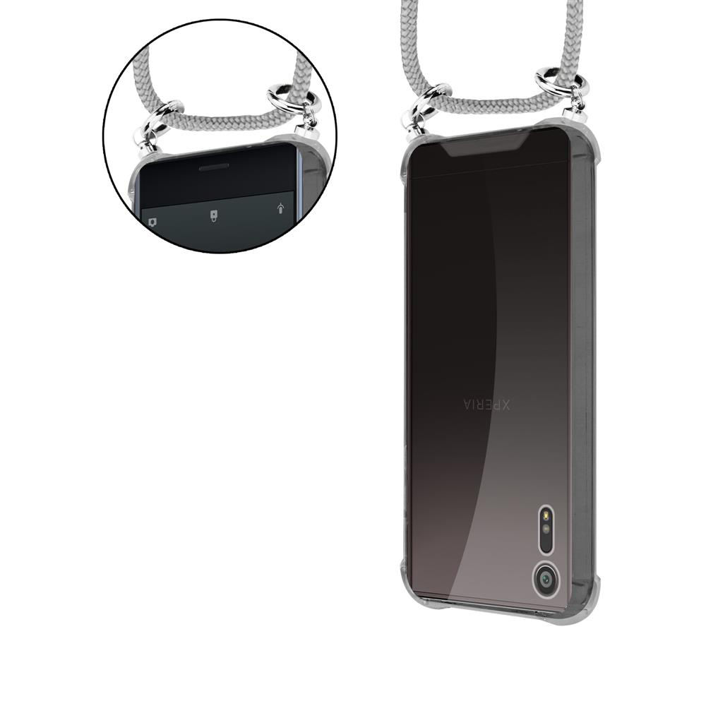 Una cover trasparente per telefono con cordino, che mostra il logo Xperia.