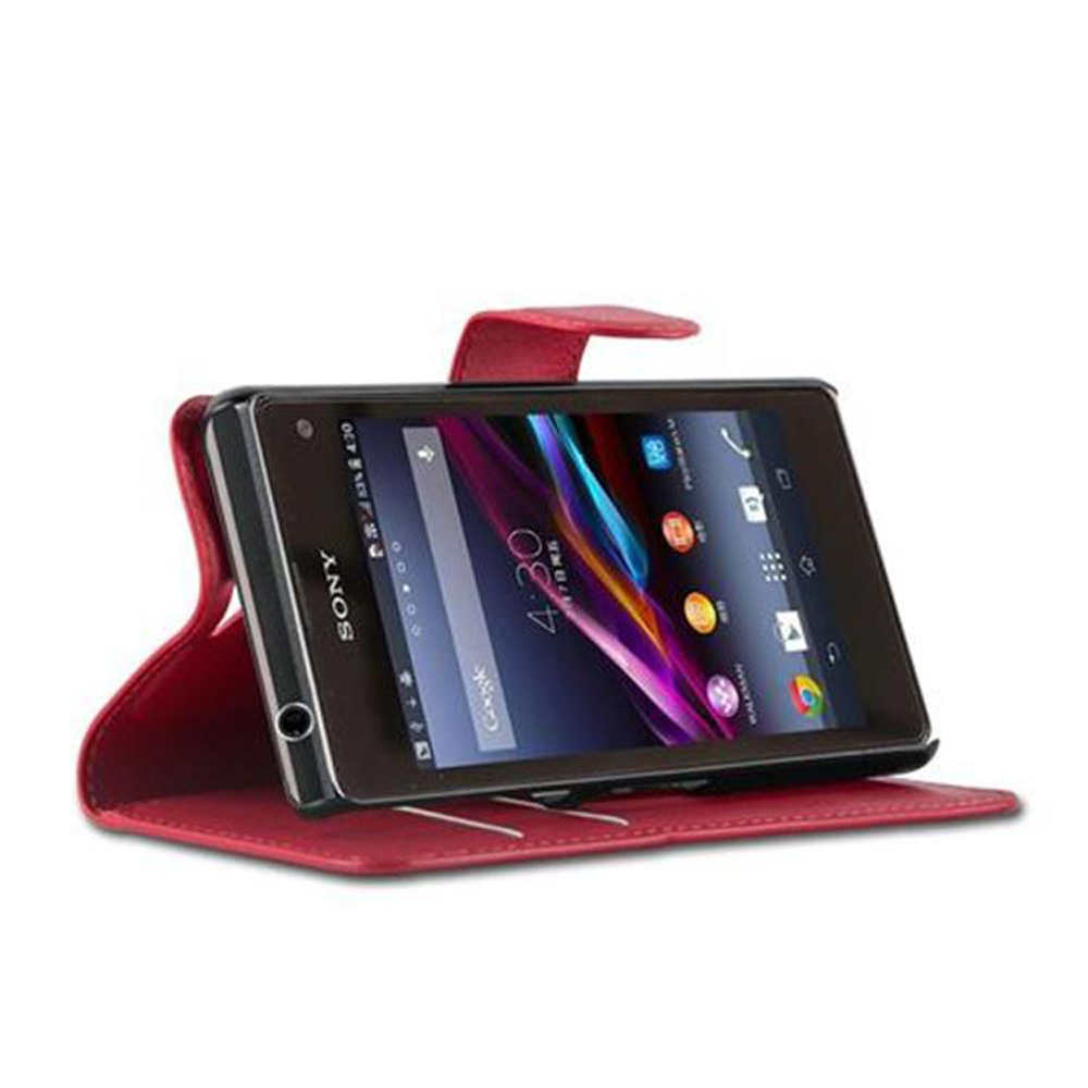 Smartphone rosso in custodia, schermo mostra le 4:30.