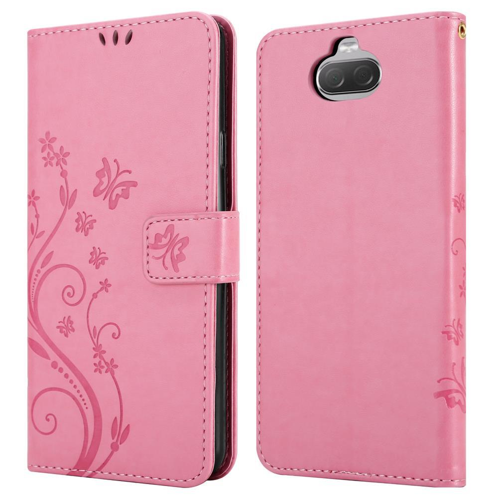 Una custodia per telefono rosa con motivo a farfalla e chiusura magnetica.