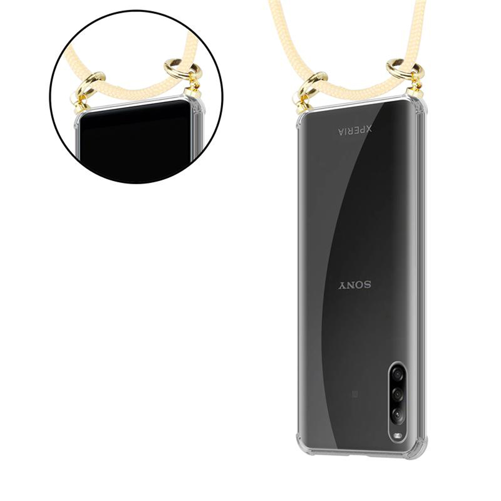 Una custodia trasparente per telefono con cinturino e hardware dorato.
