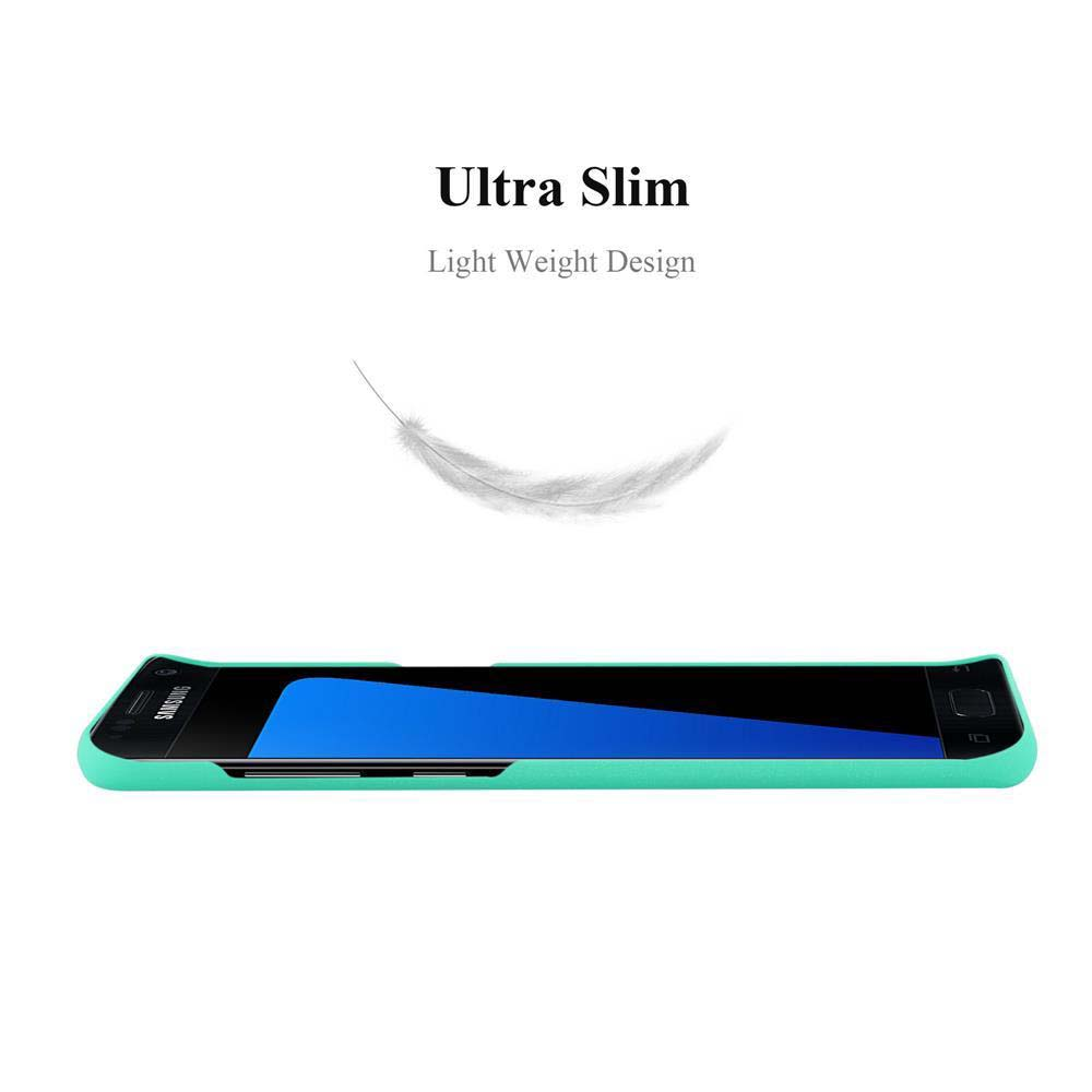 Teléfono inteligente delgado con pantalla azul en carcasa verde menta, pluma encima.