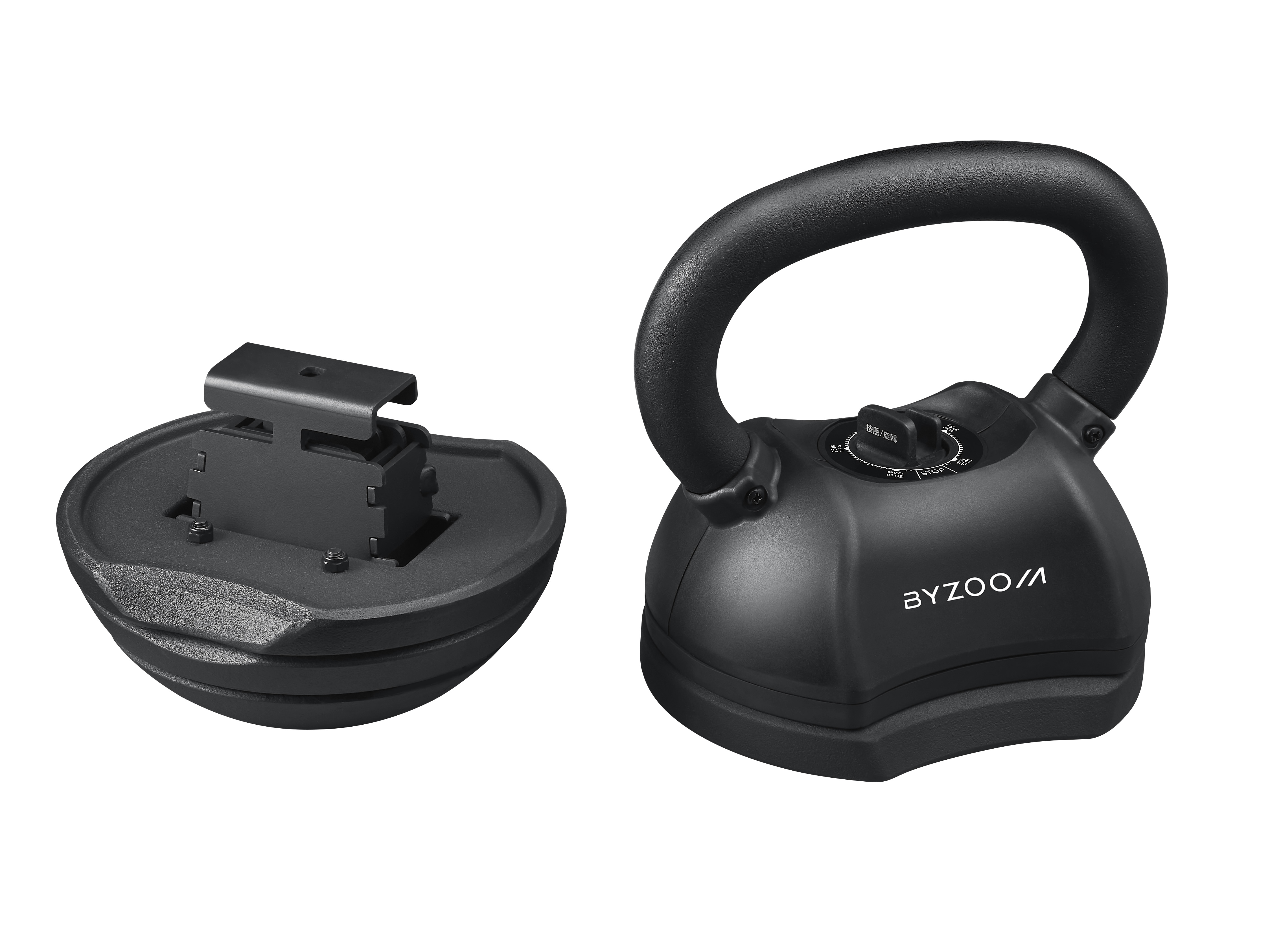 Une kettlebell réglable noire avec sa base, sur fond blanc.
