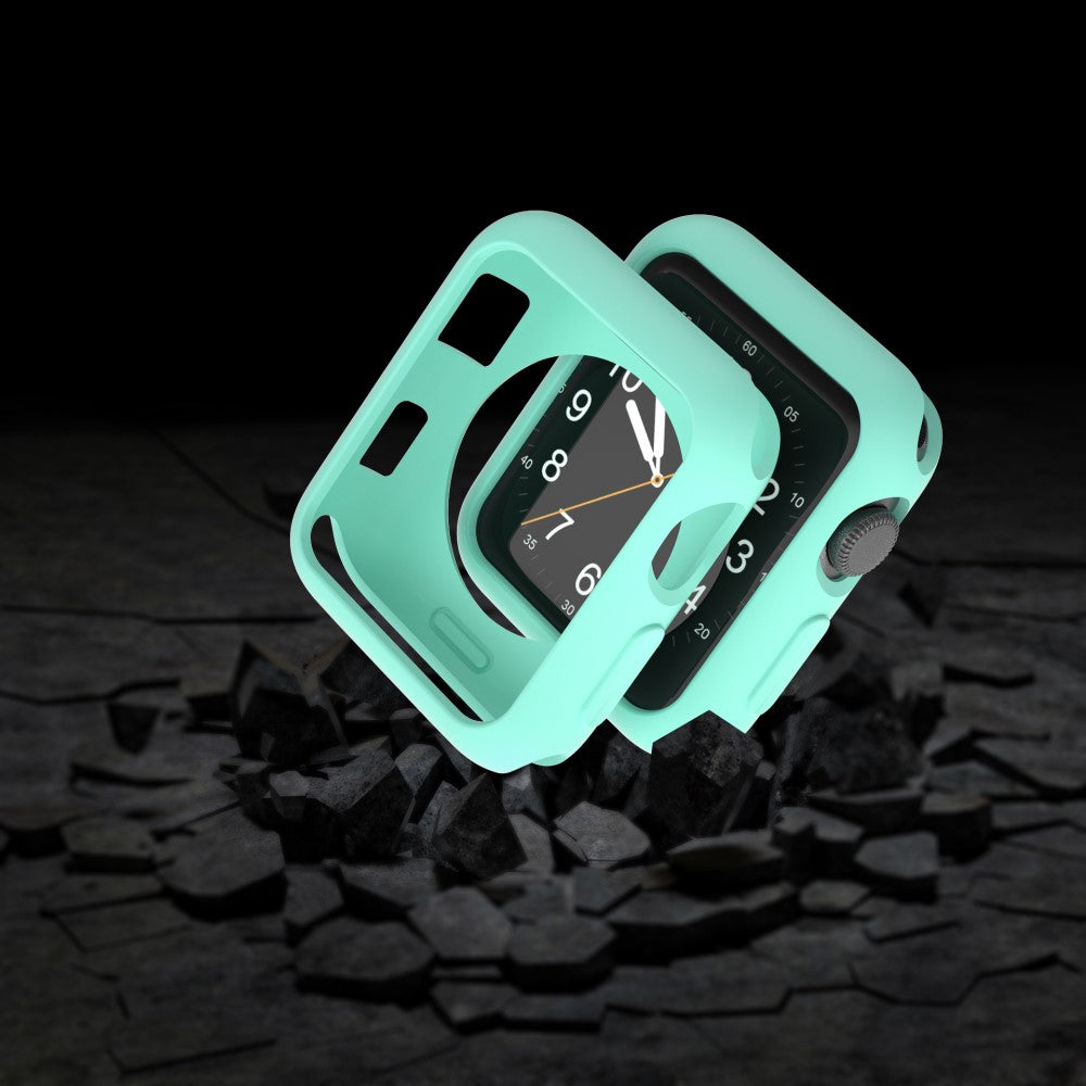Una custodia verde menta protegge un Apple Watch su pietre scure.