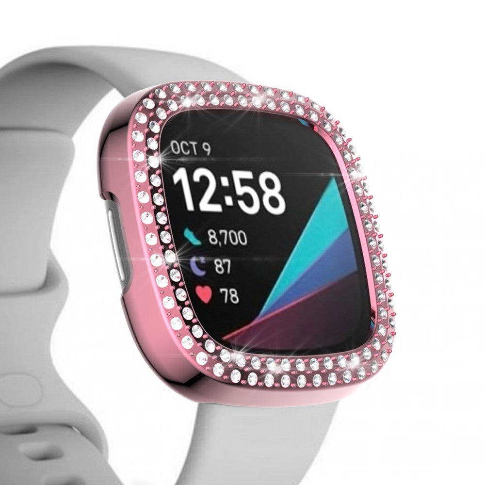 Custodia rosa per smartwatch con cristalli. Visualizza 12:58, passi e battito cardiaco.