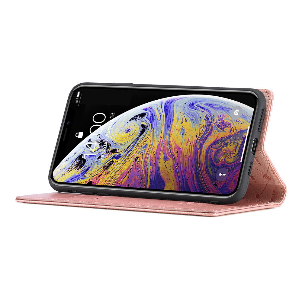 Una custodia a libro rosa che tiene uno smartphone con uno sfondo colorato.