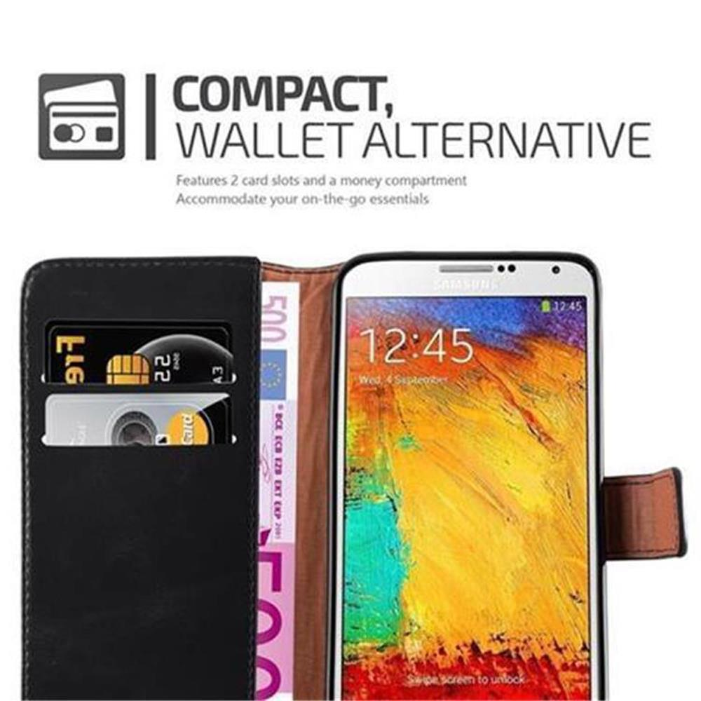 Funda de teléfono negra con ranuras para tarjetas y bolsillo para dinero, junto a un smartphone.
