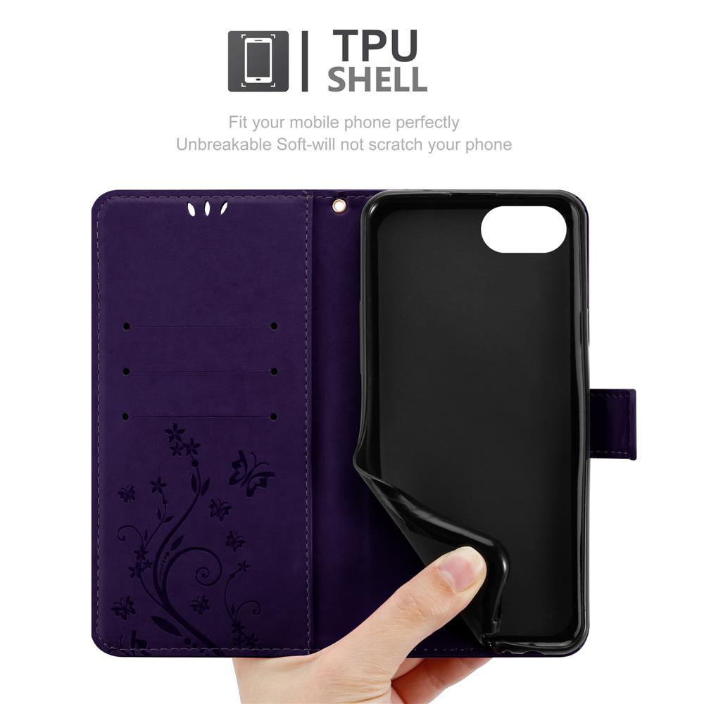 Custodia viola per telefono con motivo floreale e inserto nero. Un dito tiene la custodia.