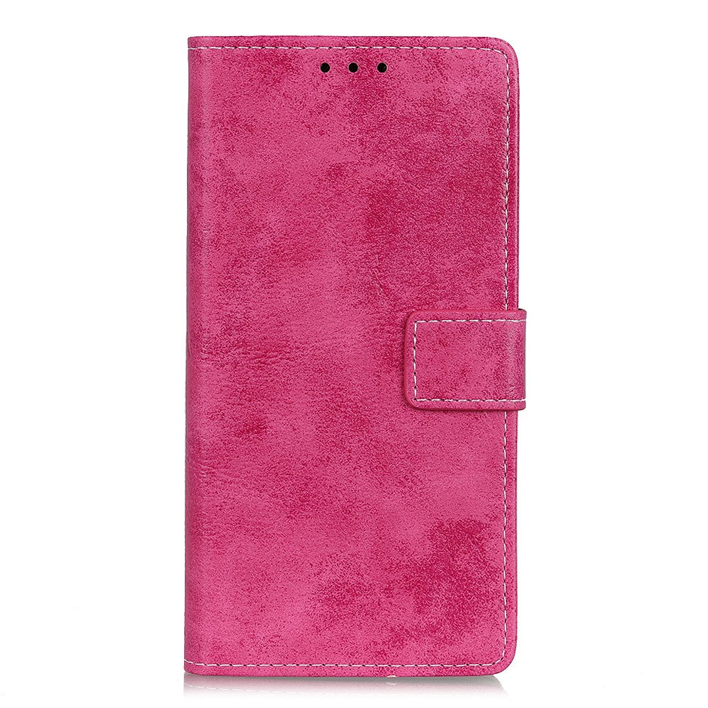 Una custodia per cellulare di colore rosa con chiusura.