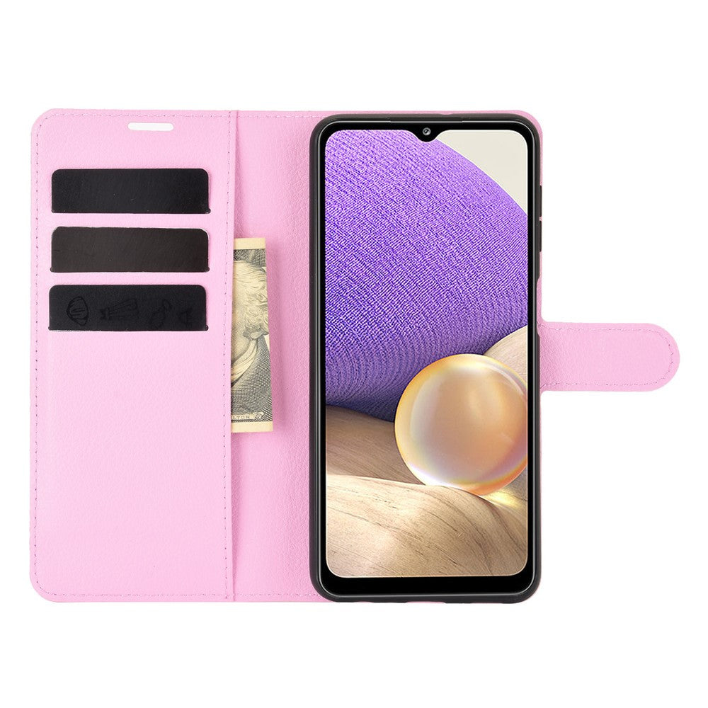 Una custodia a libro rosa con una banconota e un cellulare.