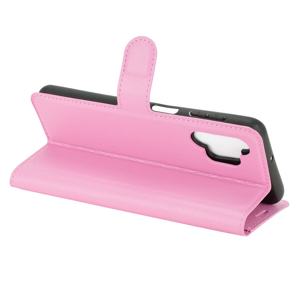 Una custodia a portafoglio per telefono in pelle rosa aperta.