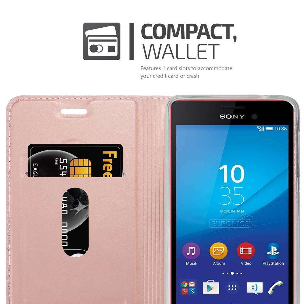 Una funda tipo cartera rosa con teléfono y tarjetas dentro.