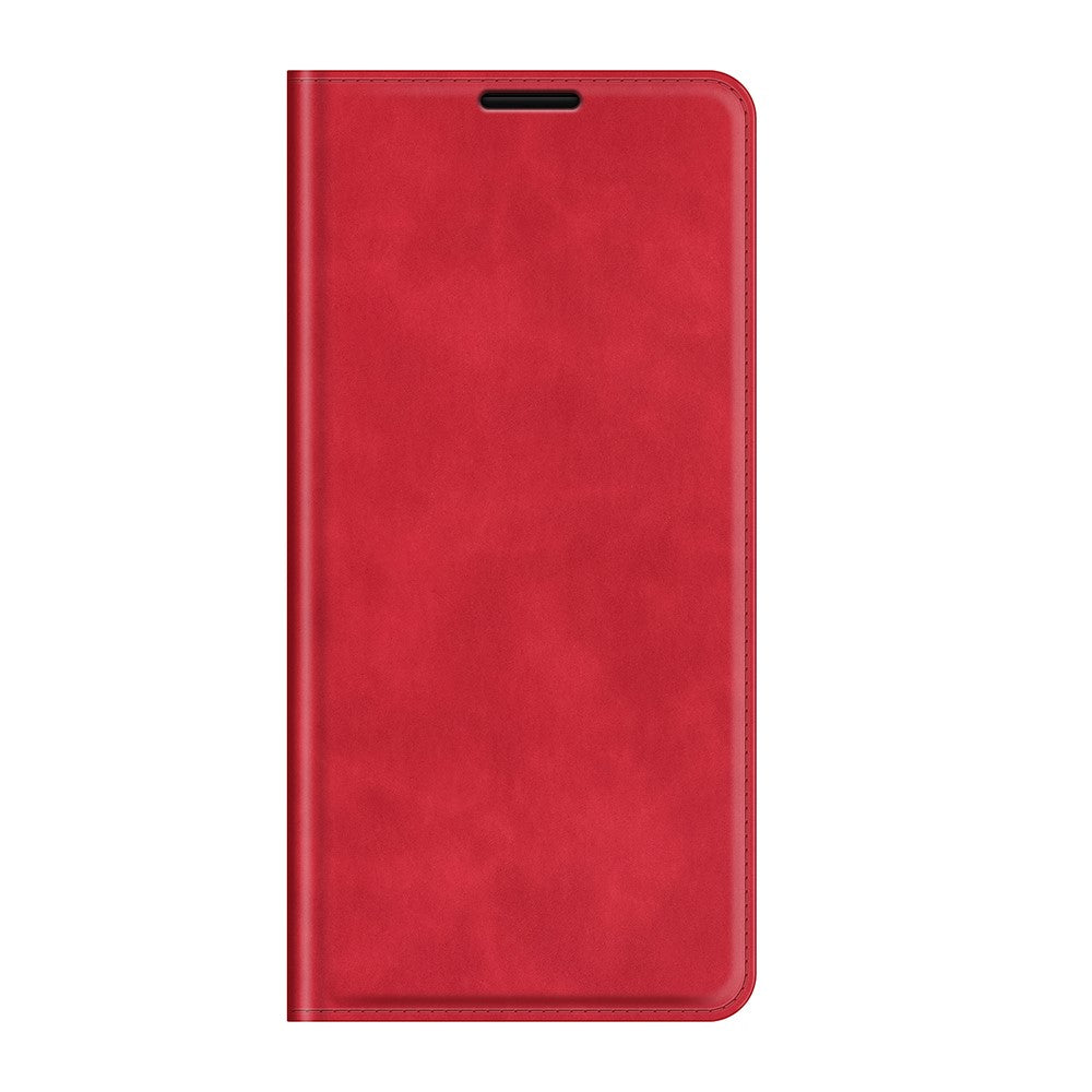 Custodia rossa a libro per telefono con cuciture e taglio.
