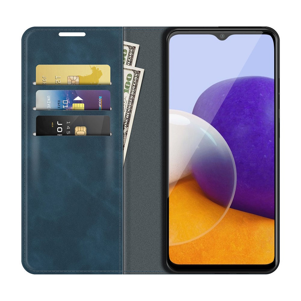 Un portafoglio blu per telefono con fessure per carte e banconote accanto.