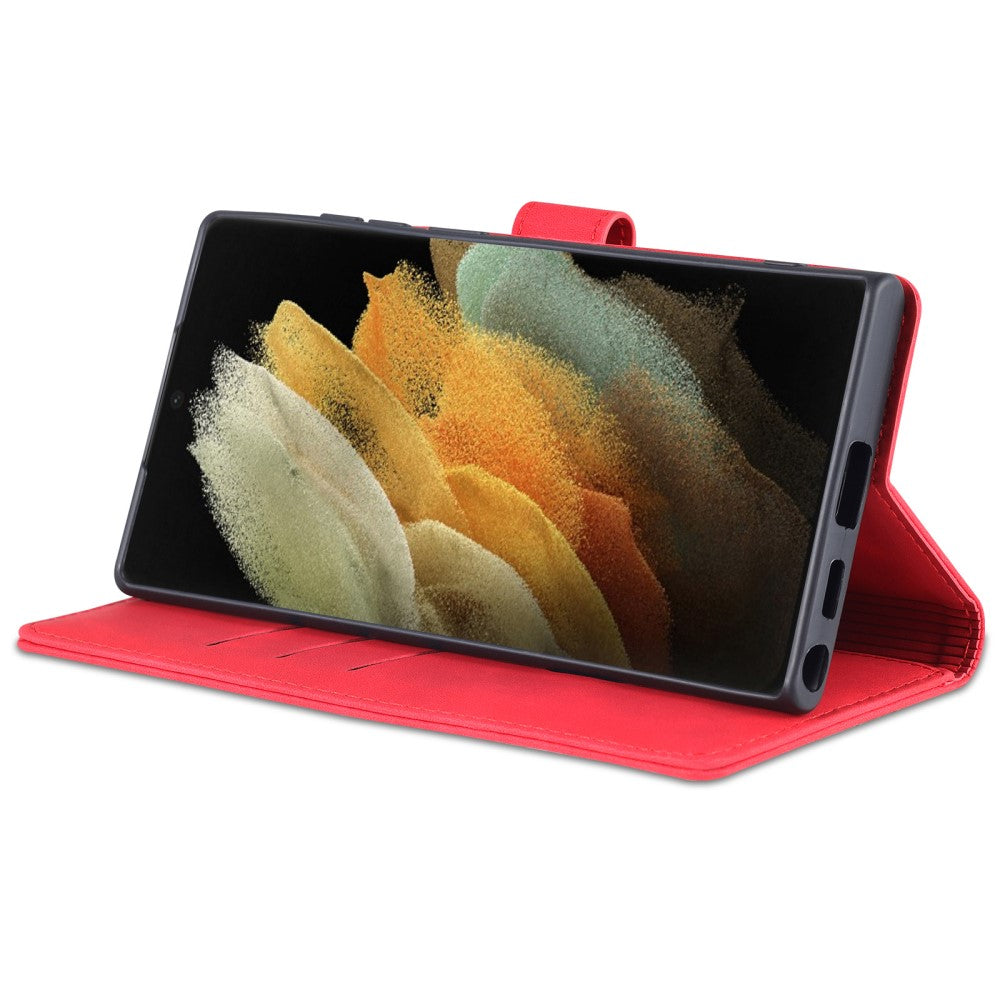Una custodia rossa per telefono con uno smartphone che mostra un screensaver colorato.