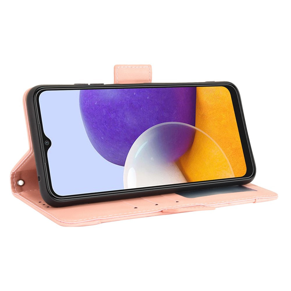 Una custodia a flip rosa per telefono con uno smartphone che mostra grafiche di sfondo viola e gialle.