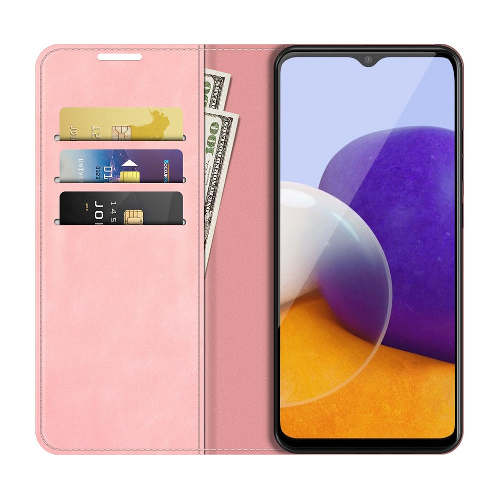 Custodia rosa per telefono con slot per carte e banconote, accanto a uno smartphone.
