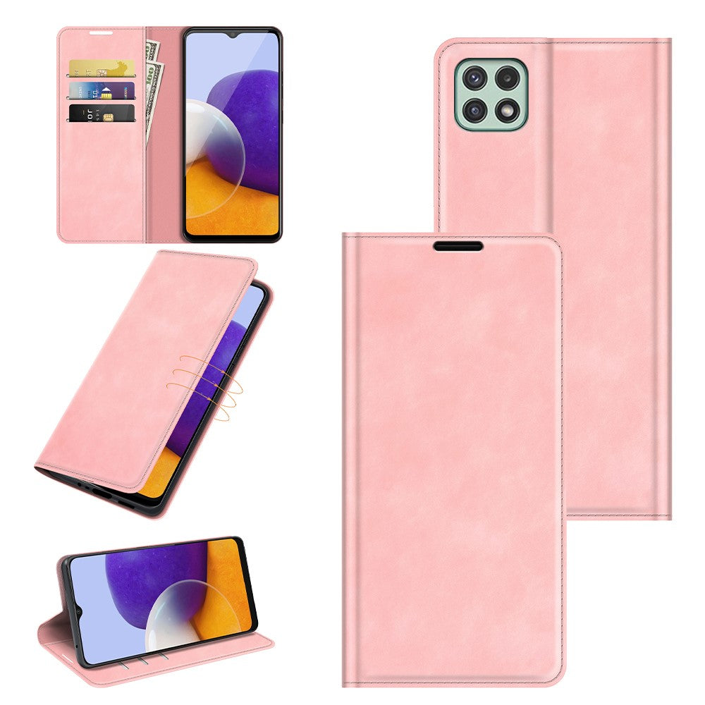 Custodia rosa per telefono con slot per carte e un telefono che mostra uno sfondo viola e arancione.