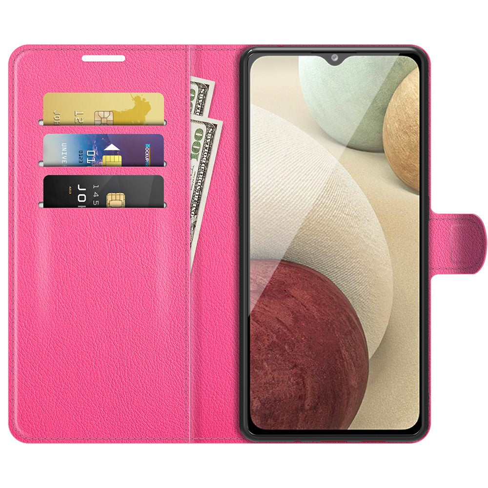 Custodia a portafoglio rosa per telefono con carte, contanti e un telefono che mostra arte astratta.