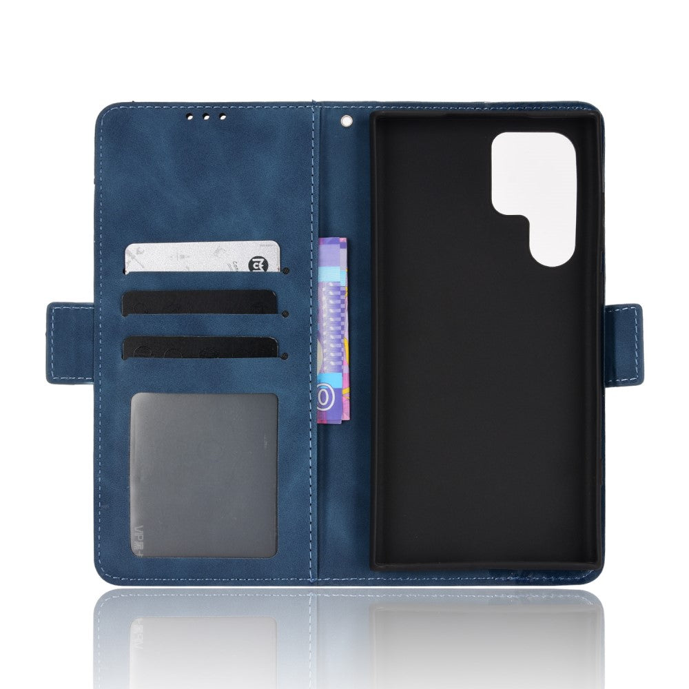 Custodia a portafoglio in pelle blu con slot per carte e finestra. Tiene il telefono.