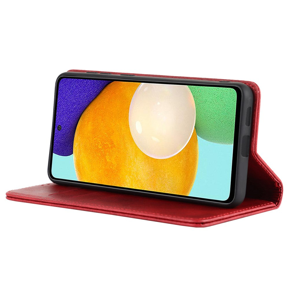 Custodia rossa aperta con smartphone che mostra sfondo arancione e blu.