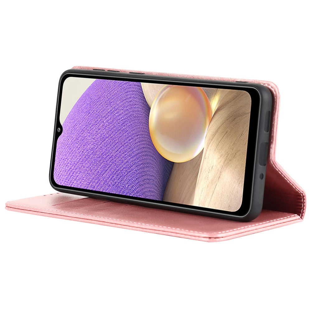 Una custodia rosa per telefono con supporto aperto, che mostra uno smartphone con sfondo a motivo di legno e viola.