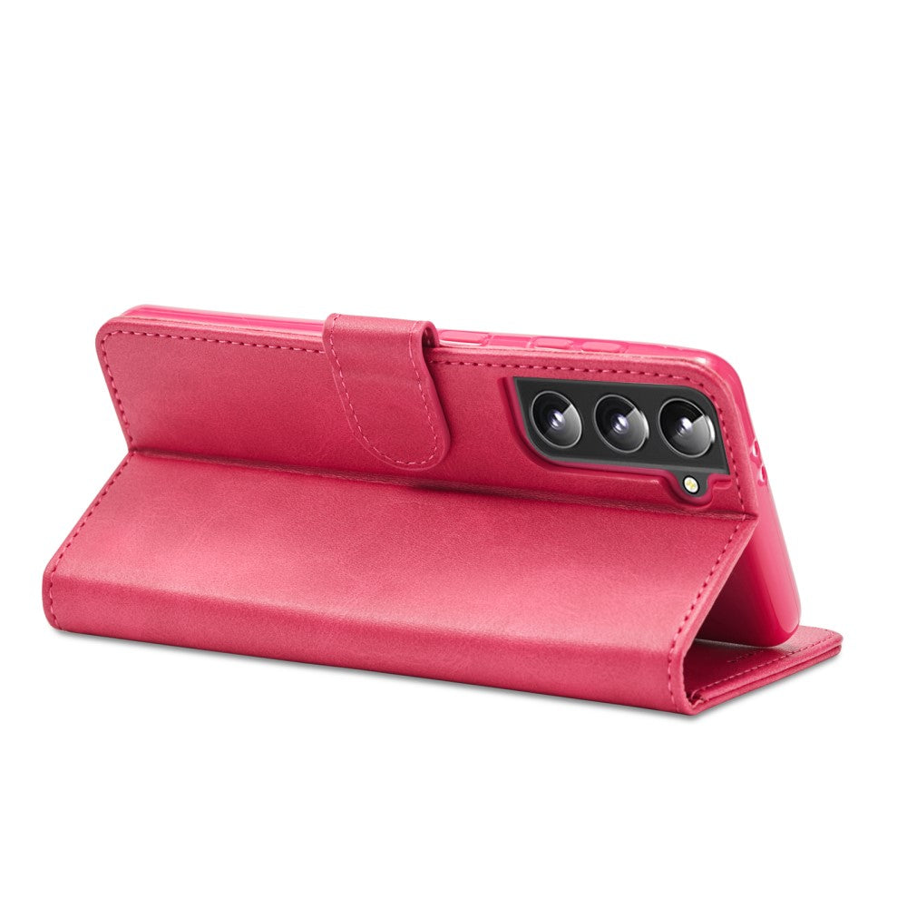 Custodia a libro rosa per telefono con tre obiettivi della fotocamera.