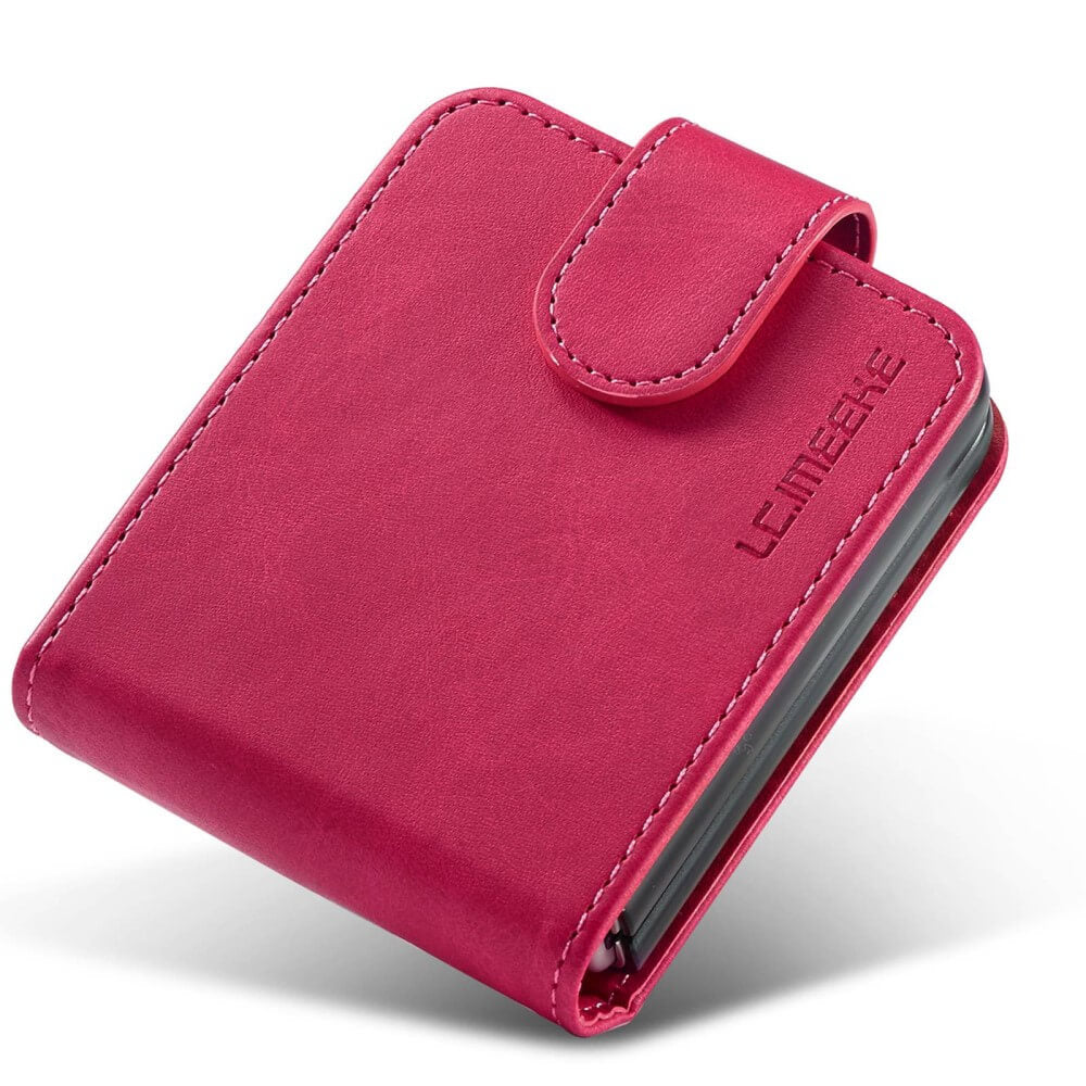 Ein geschlossenes, pinkes Handycover aus Leder mit Nähten und einem L.C.MEEKE-Logo.