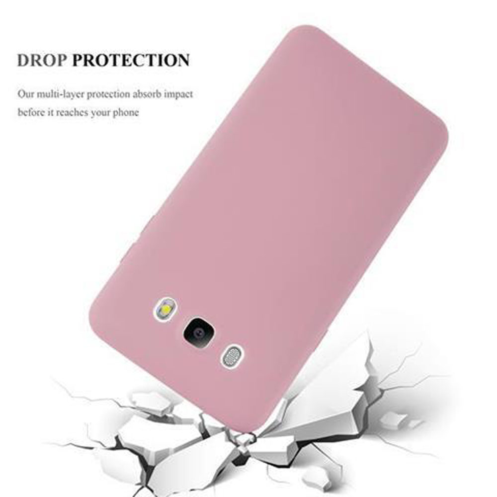 Funda de teléfono rosa rompiendo una superficie blanca.