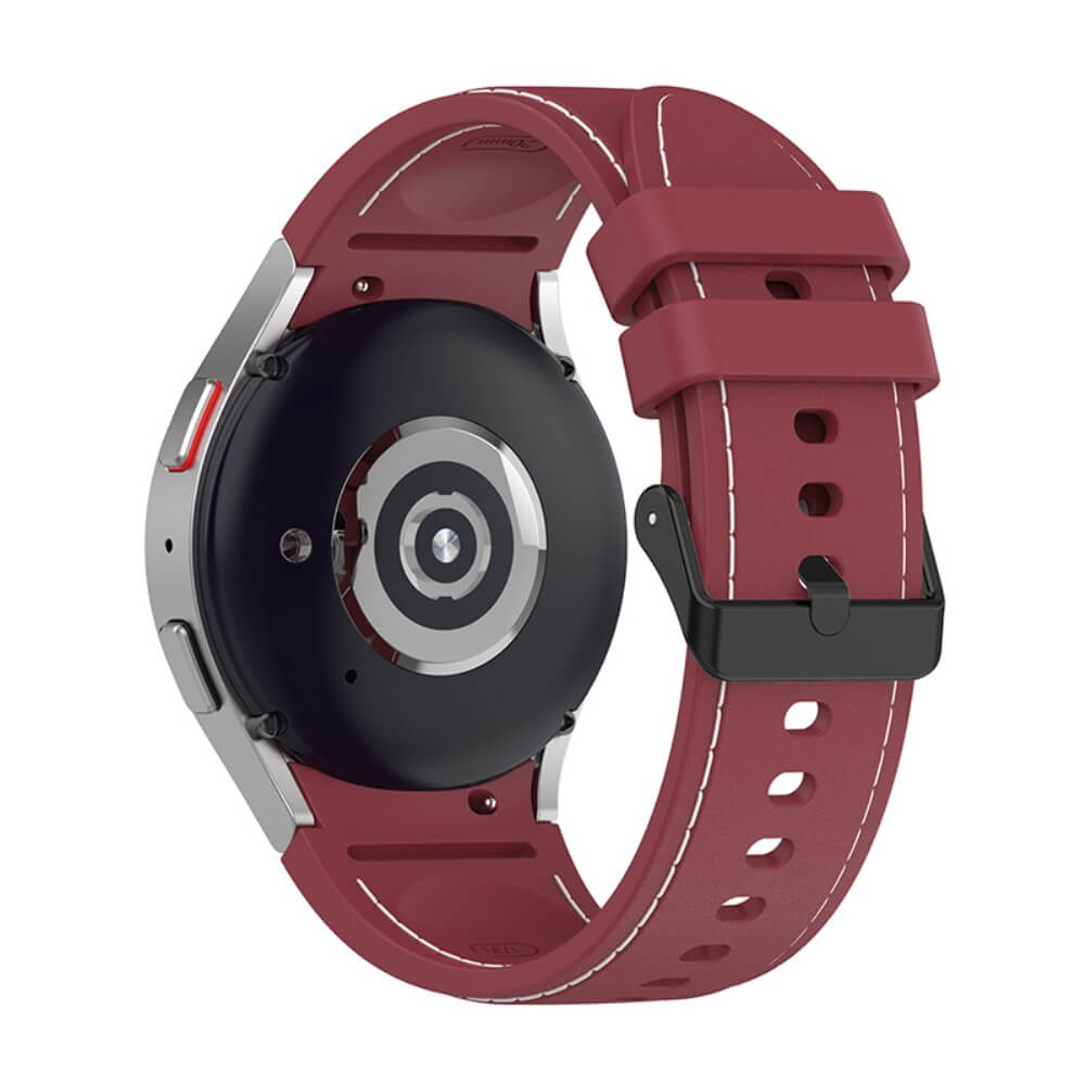 Montre connectée rouge avec boîtier argenté et boucle noire, vue arrière.