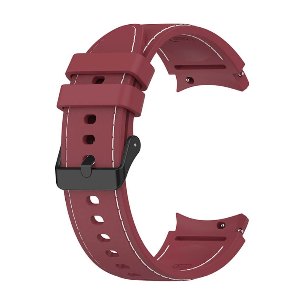 Un bracelet de montre en caoutchouc rouge foncé avec surpiqûres blanches et boucle noire.