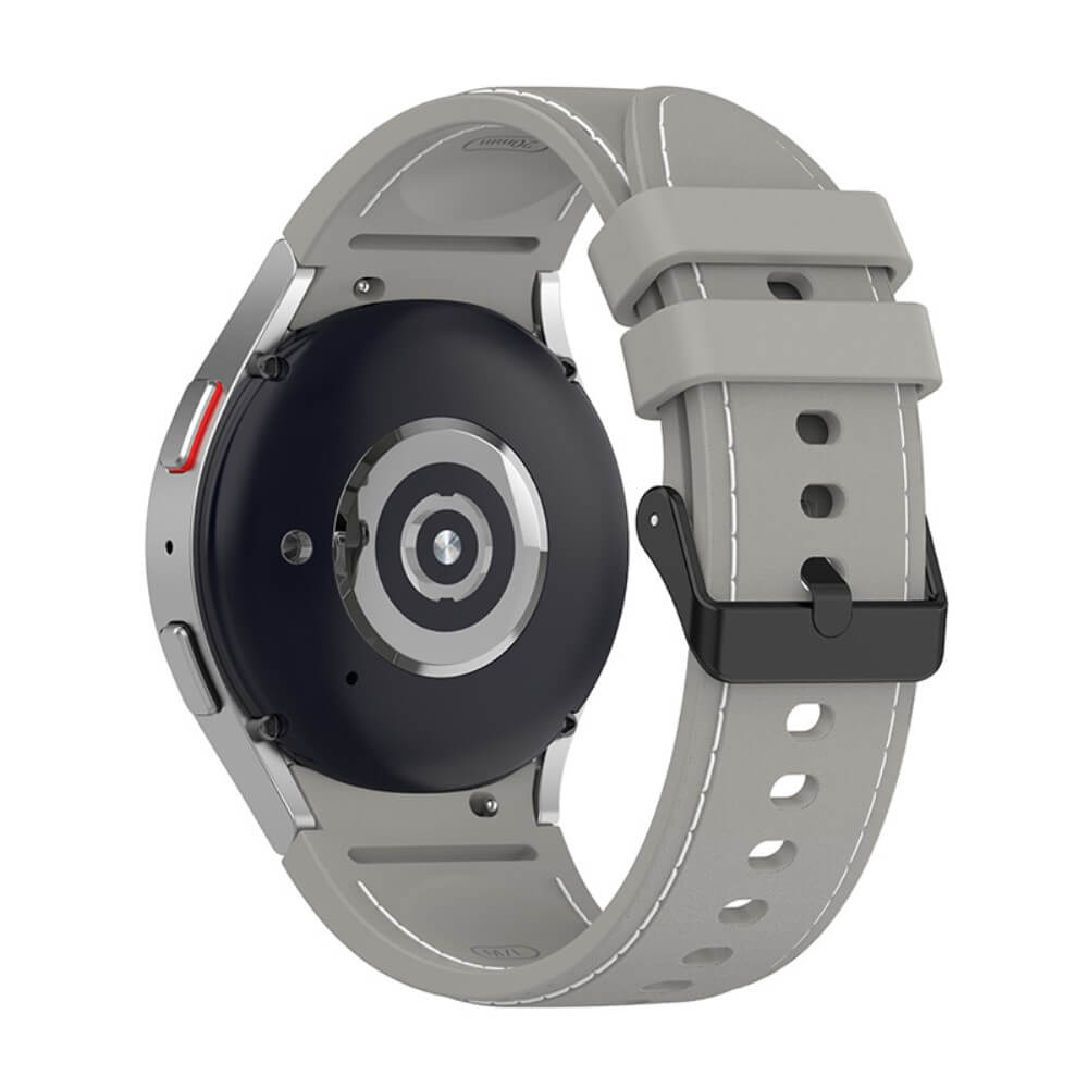 Dos d'une montre connectée grise avec bracelet noir et boucle métallique. Capteurs visibles.