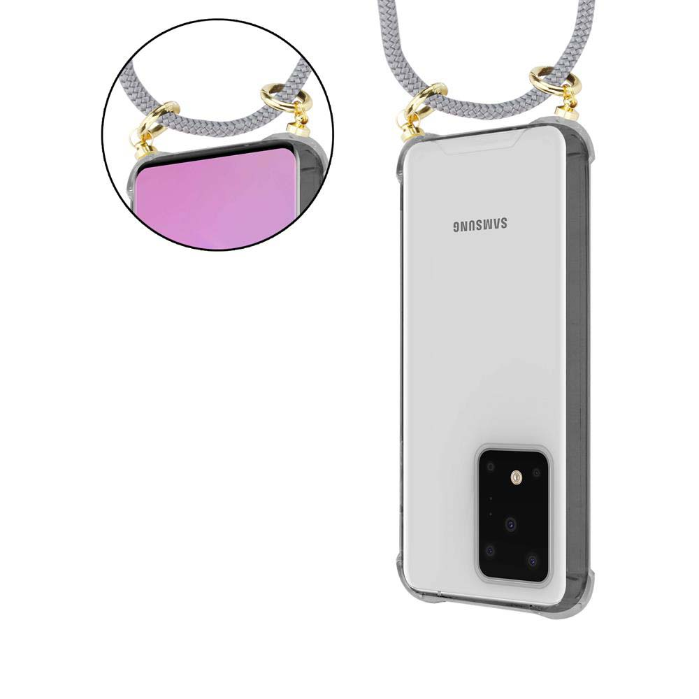 Un laccetto grigio per telefono è attaccato a una custodia trasparente Samsung.