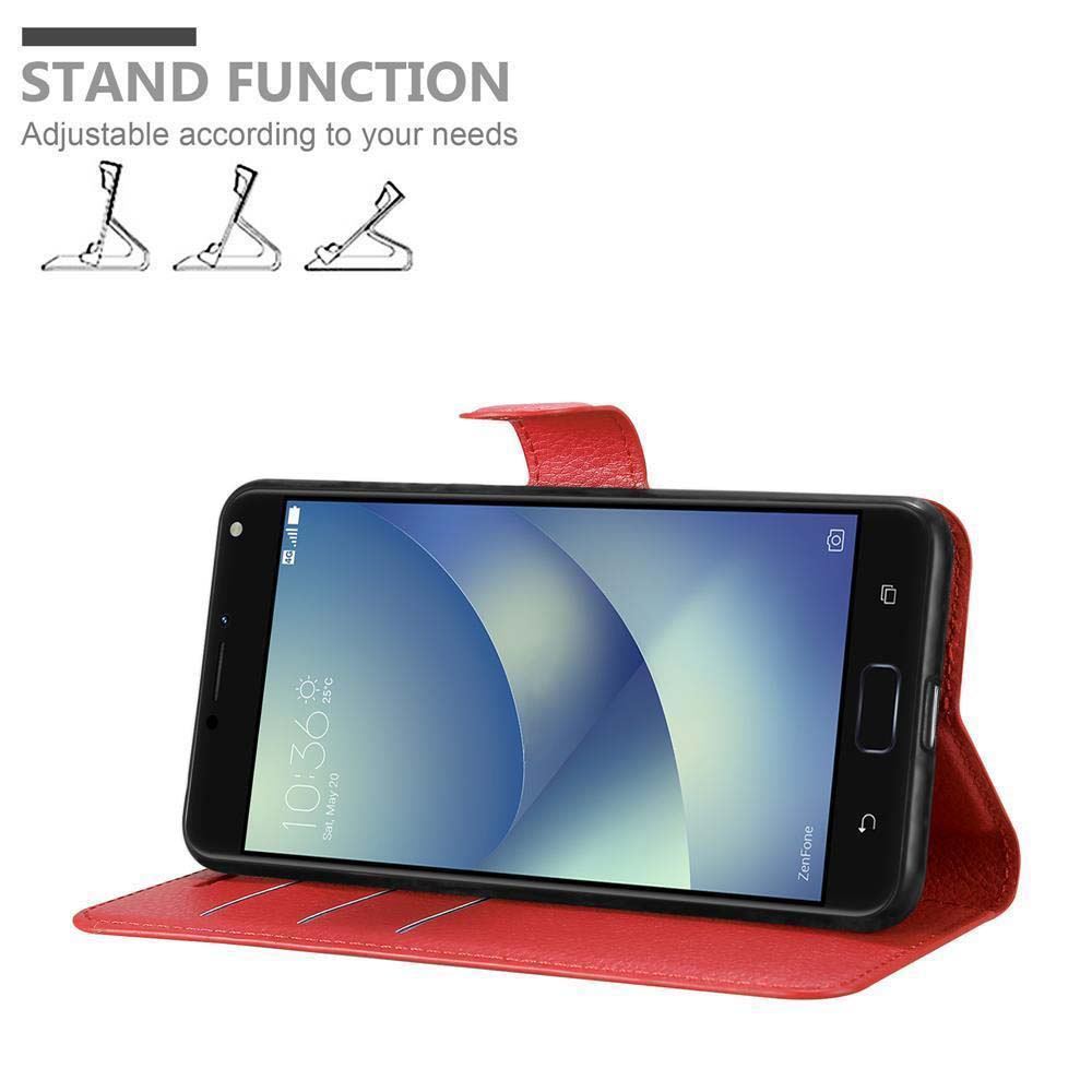 Un telefono rosso in una custodia che funge da supporto.