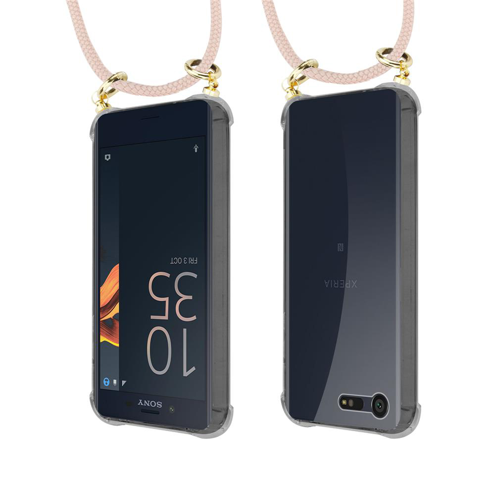Un smartphone con correa rosa y herrajes dorados unidos a su funda.