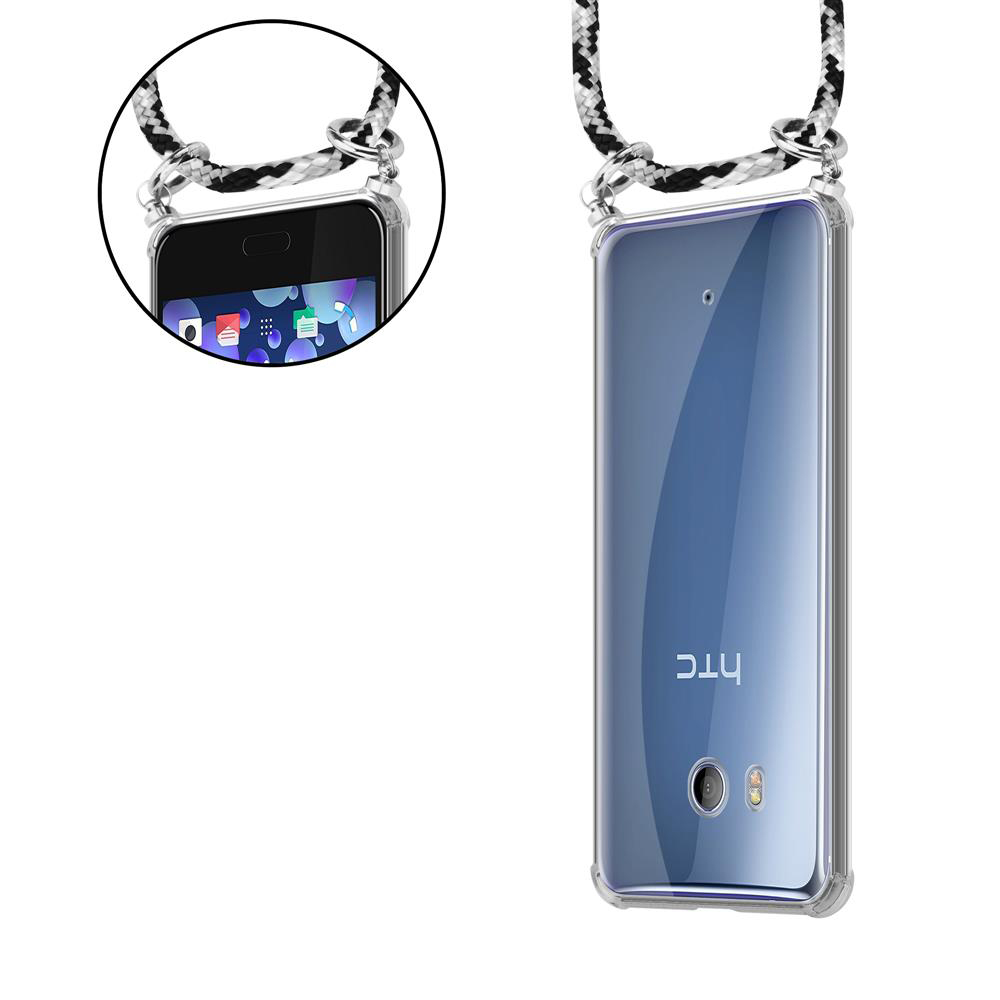Ein durchsichtiges Handy mit schwarzem und weißem Band, das von oben herabhängt.