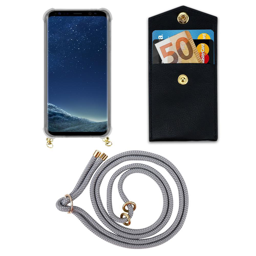Smartphone in custodia, portafoglio con soldi e carte, cordino.